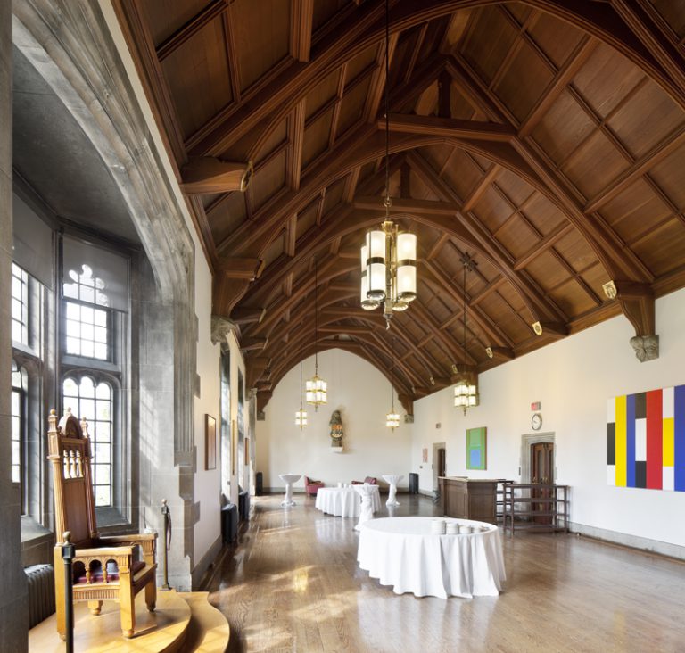 Debates room at Hart House from eye level. Wood vaulted ceilings and floors.