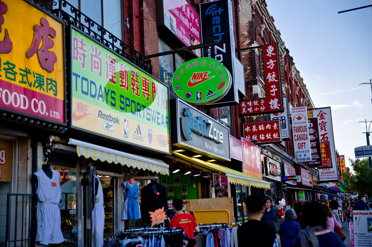 Colourful store signs with English and Chinese writing. Photo credit: Tourism Toronto.